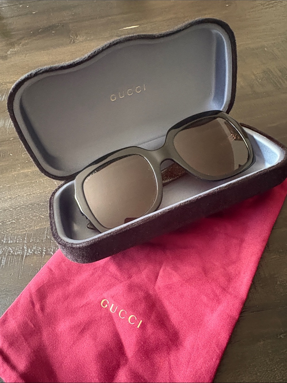 Gucci Black Frame Sunglasses with Brown Lenses